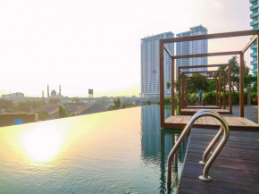 Comfort 1BR without Living Room at Grand Kamala Lagoon Apartment By Travelio